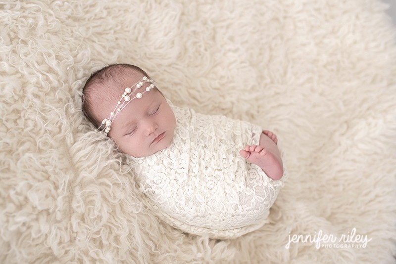 Newborn in lace wrap